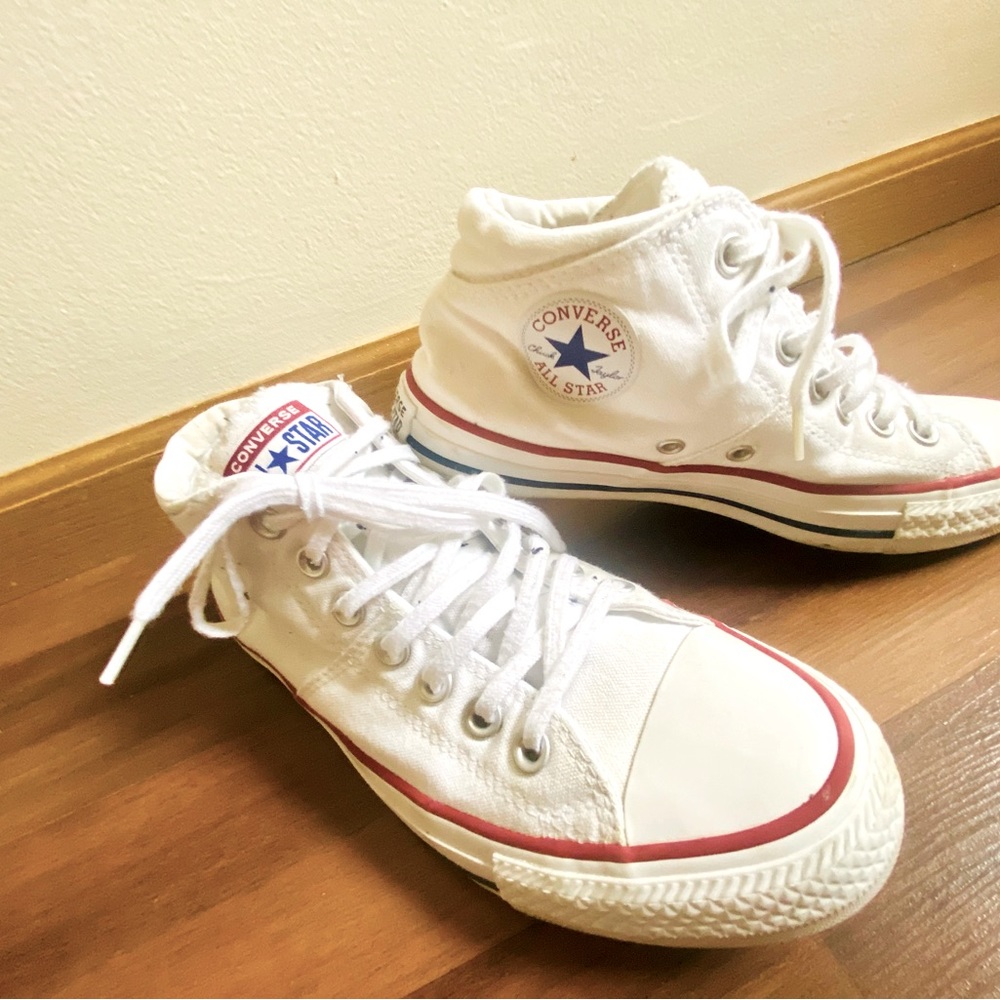 Converse women’s White high tops.